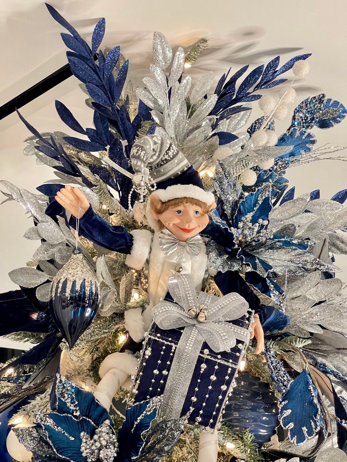 A second elf, offering a gift.