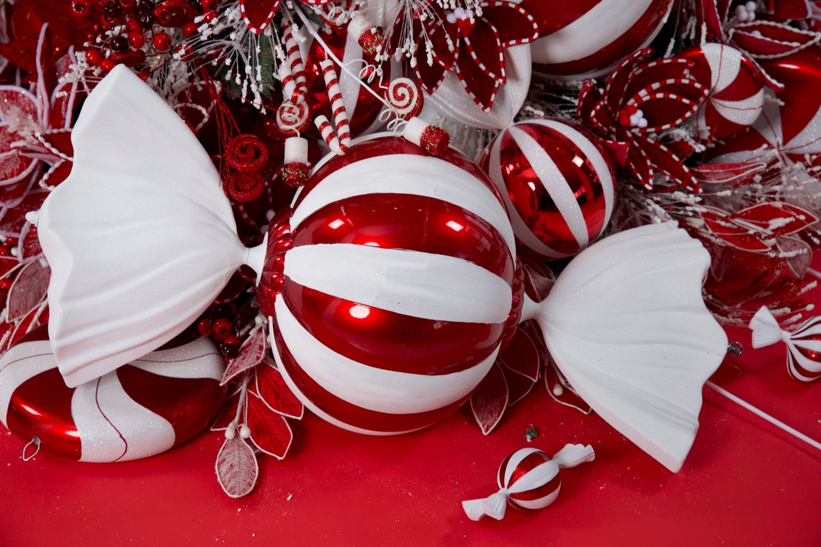 A wrapped sweet at the base, ends tied in white.