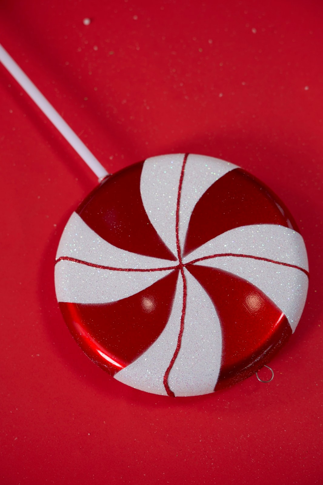The lollipop, standing on the floor.