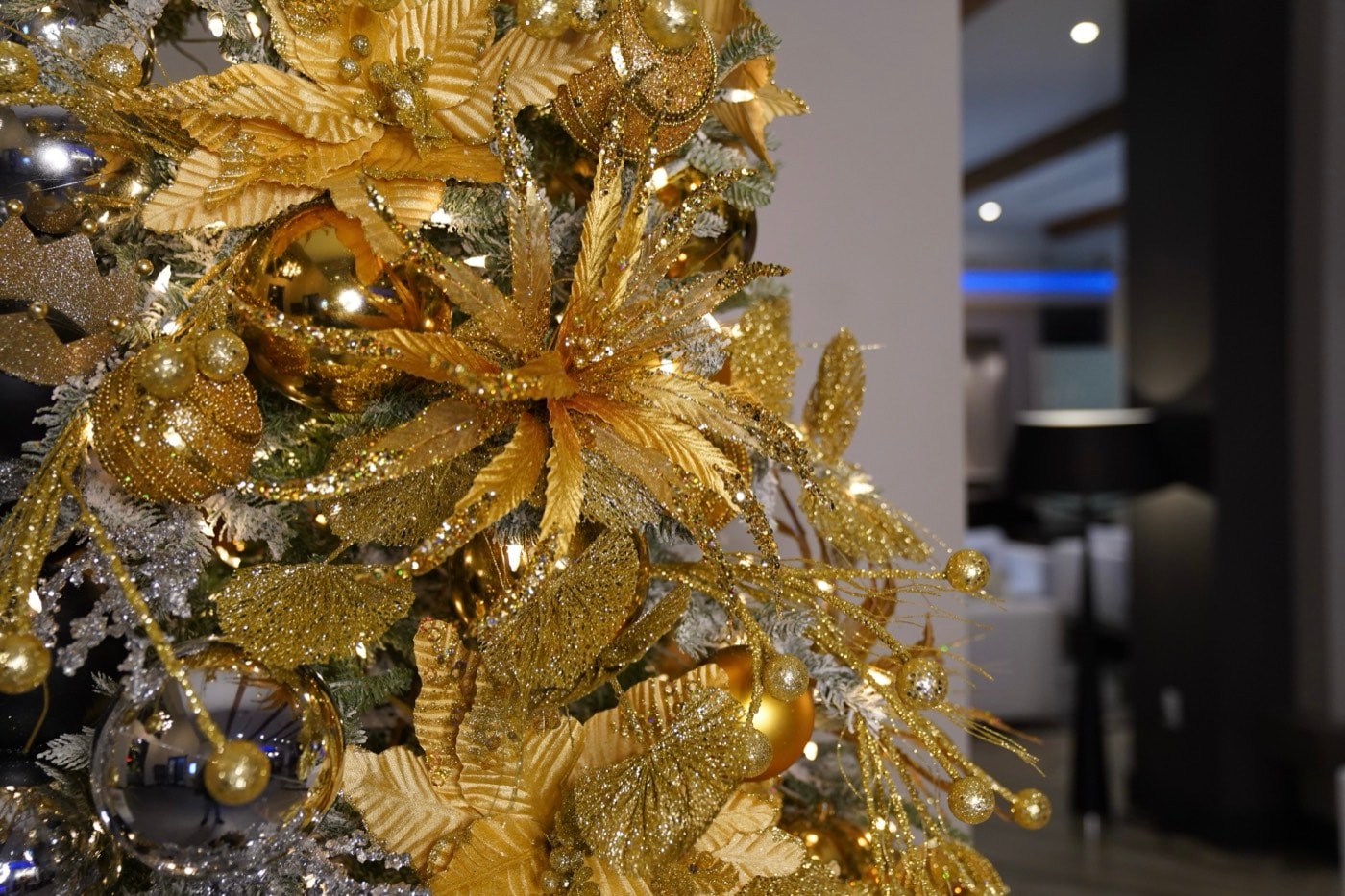 Gold velvet poinsettia, glitter leaf, and a mirrored bauble.